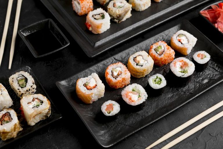 flat-lay-delicious-sushi-with-sauce