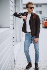 Young handsome man model posing in the street
